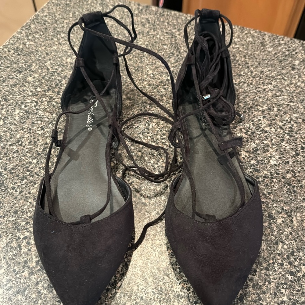 Suede-like flats that tie around ankles